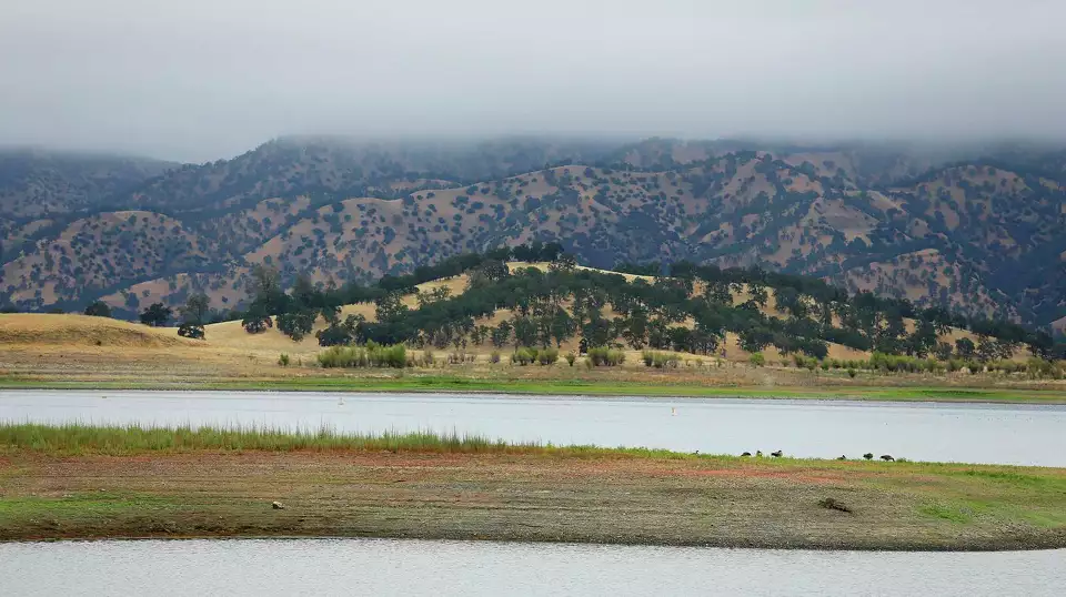 FILE - Lake Berryessa is seen with parts of California's newest national monument in the background, July 10, 2015, near Berryessa Snow Mountain National Monument, Calif. President Biden has expanded two culturally significant California landscapes: the San Gabriel Mountains National Monument in Southern California and Berryessa Snow Mountain National Monument in Northern California. The U.S. National Park Service notes that the move Thursday, May 2, 2024 was allowed under the Antiquities Act of 1906. Eric Risberg/AP